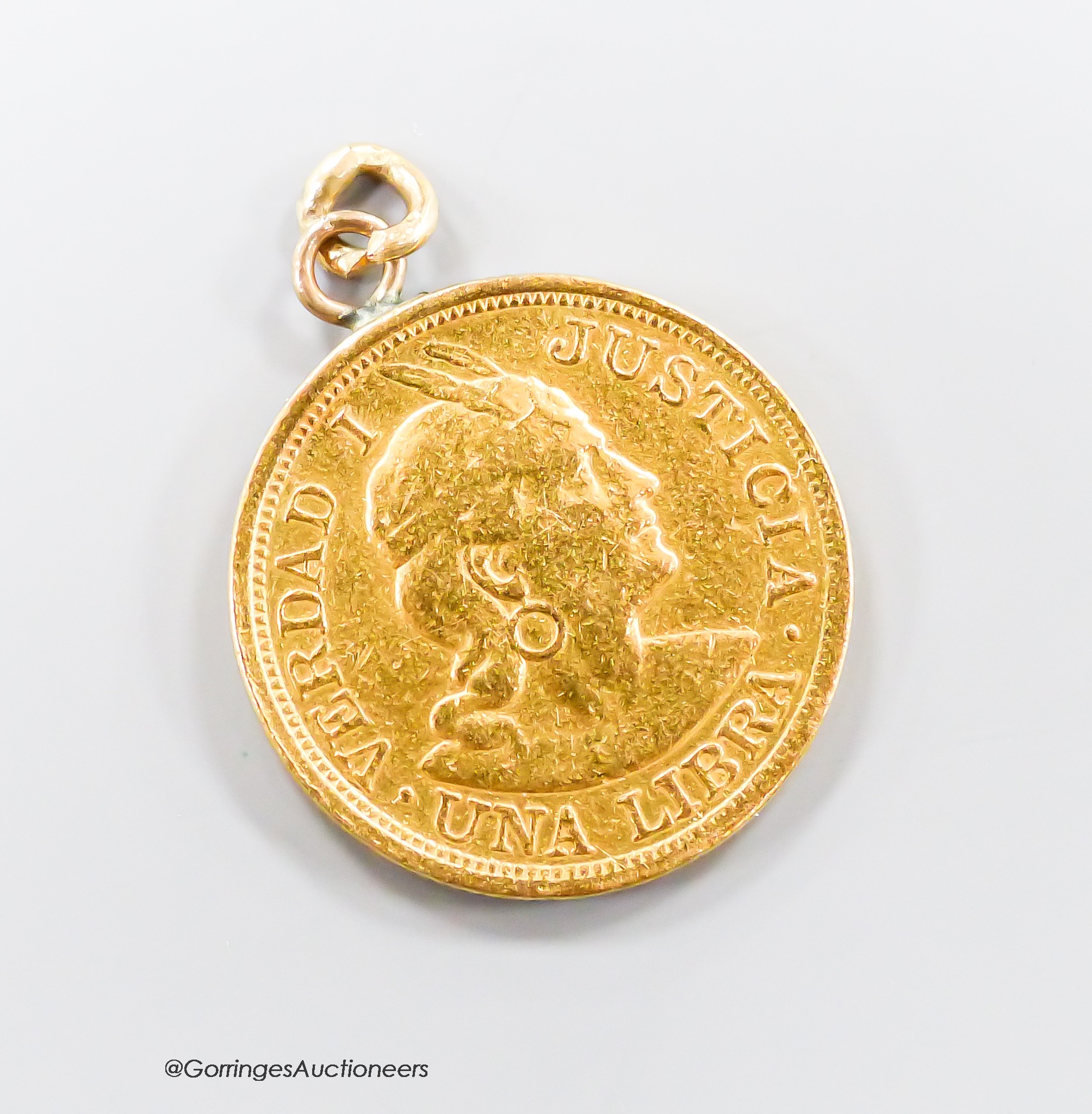 A 1911 Peruvian gold coin, now mounted as a pendant, 8.2 grams.